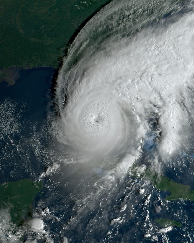 Satellite image of Hurricane Ian with a clear eye over the Gulf of Mexico, with western Cuba at the lower left.